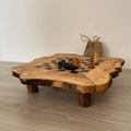 Handcrafted olive wood chess board with natural grain and chess pieces